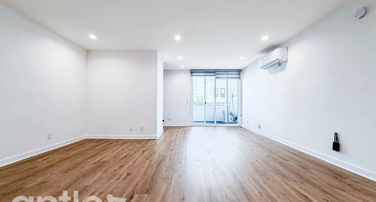 A renter in a bright unit, seen by the camera